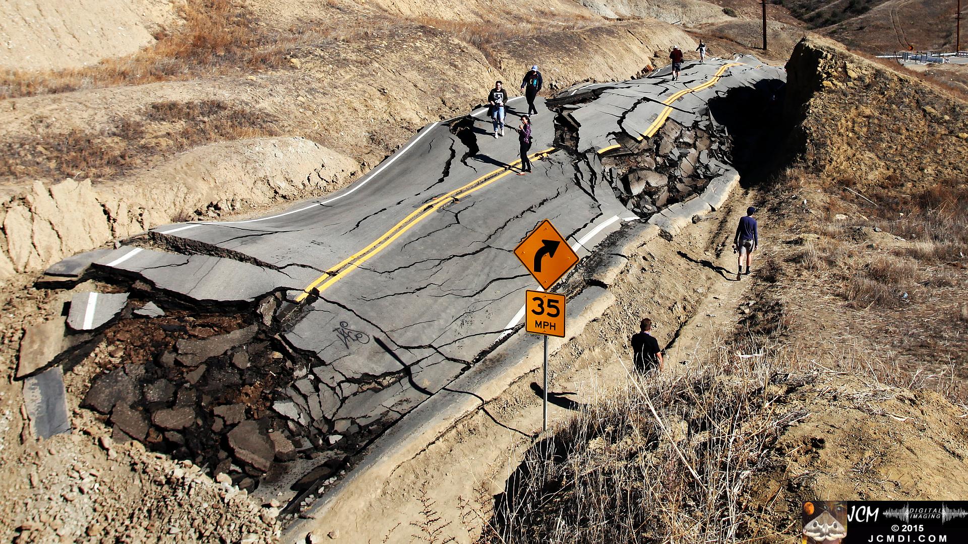 Landslide, buckled pavement, and terrain at Vasquez Canyon Road in Santa Clarita, CA filmed 11-25-2015
